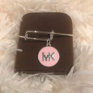 Fashion jewelry sliver bracelet with pink charm.